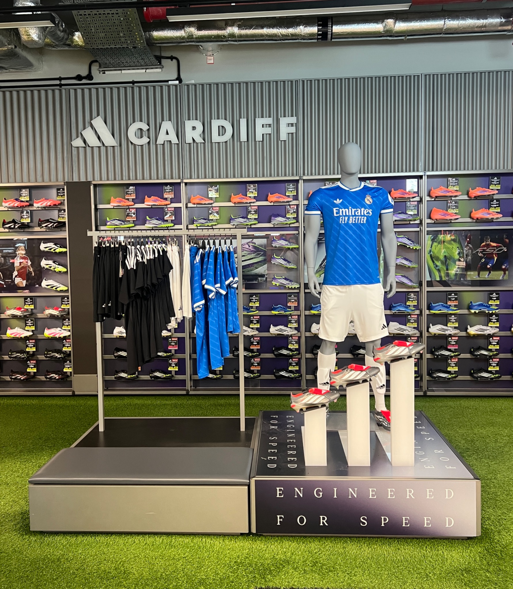 Adidas Cardiff football display installation with mannequin and boot plinths