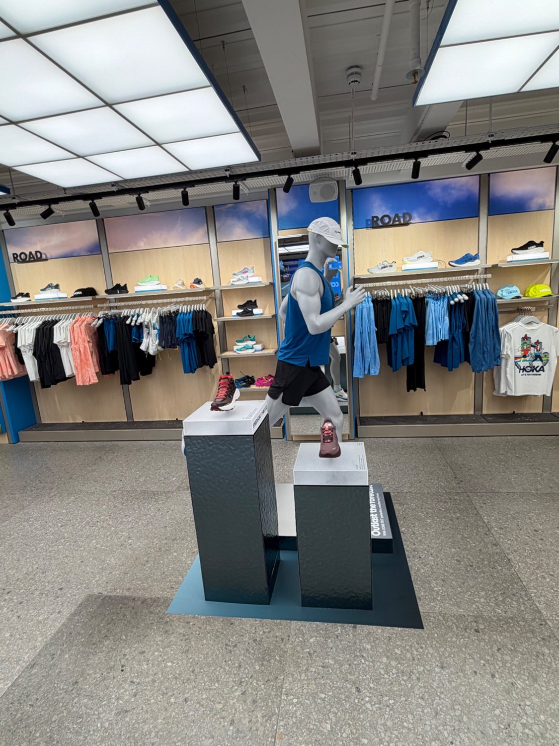 HOKA display shown against store shelving